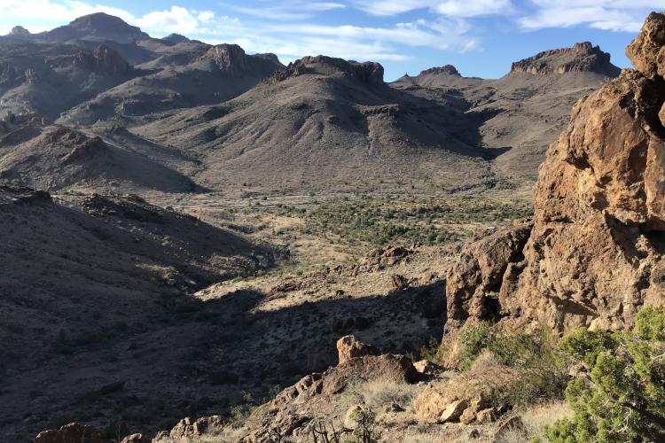 Looking southwest, across Secret Pass Wash towards the junction of the Secret Pass, Union Pass (west), Mt Nutt (south), and Oatman (southwest) 7.5’ quadrangles.  The ridge is composed of 18-19Ma  andesitic and dacitic lavas at the base of the Miocene volcanic section.