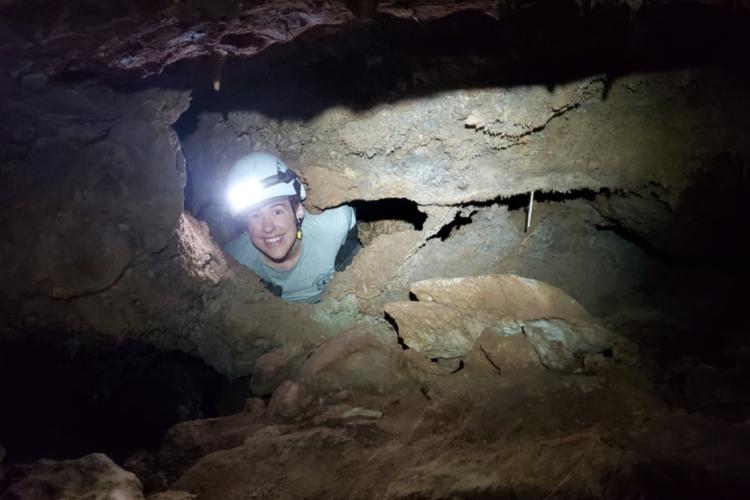 Co-author Grace Allison exploring cave in Tonto National Forest.